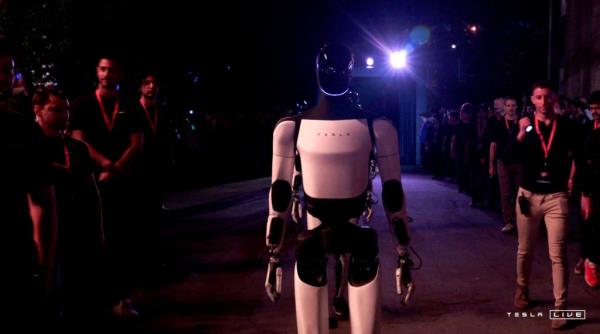 Optimus robots walk into the audience on Oct. 10, 2024 during Tesla event.