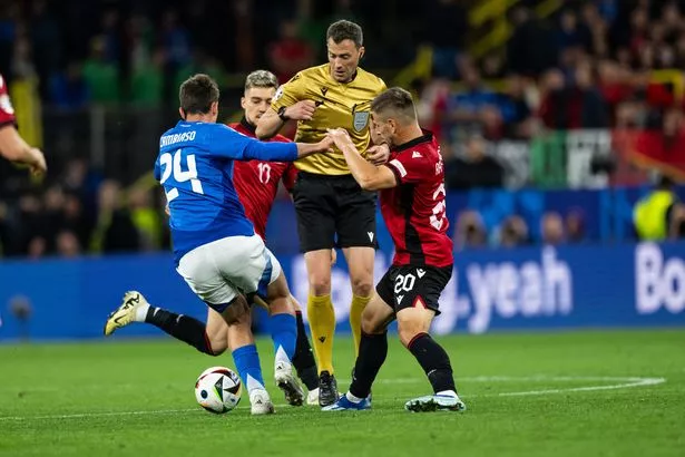 Referee Felix Zwayer (C) follows Andrea Cambiaso (L) of Italy and Ylber Ramadani of Albania (R) during the UEFA EURO 2024 group stage match between Italy and Albania at Football Stadium Dortmund on June 15, 2024 in Dortmund, Germany