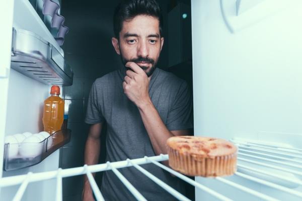 Man eating late-night snack